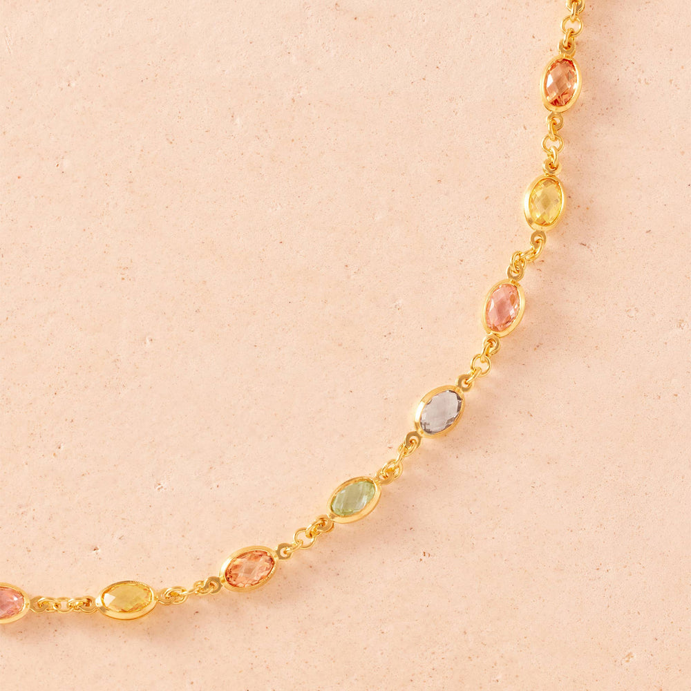 Necklace with multicolored beads on a white background
