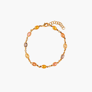 Gold bracelet with multicolored beads on a white background