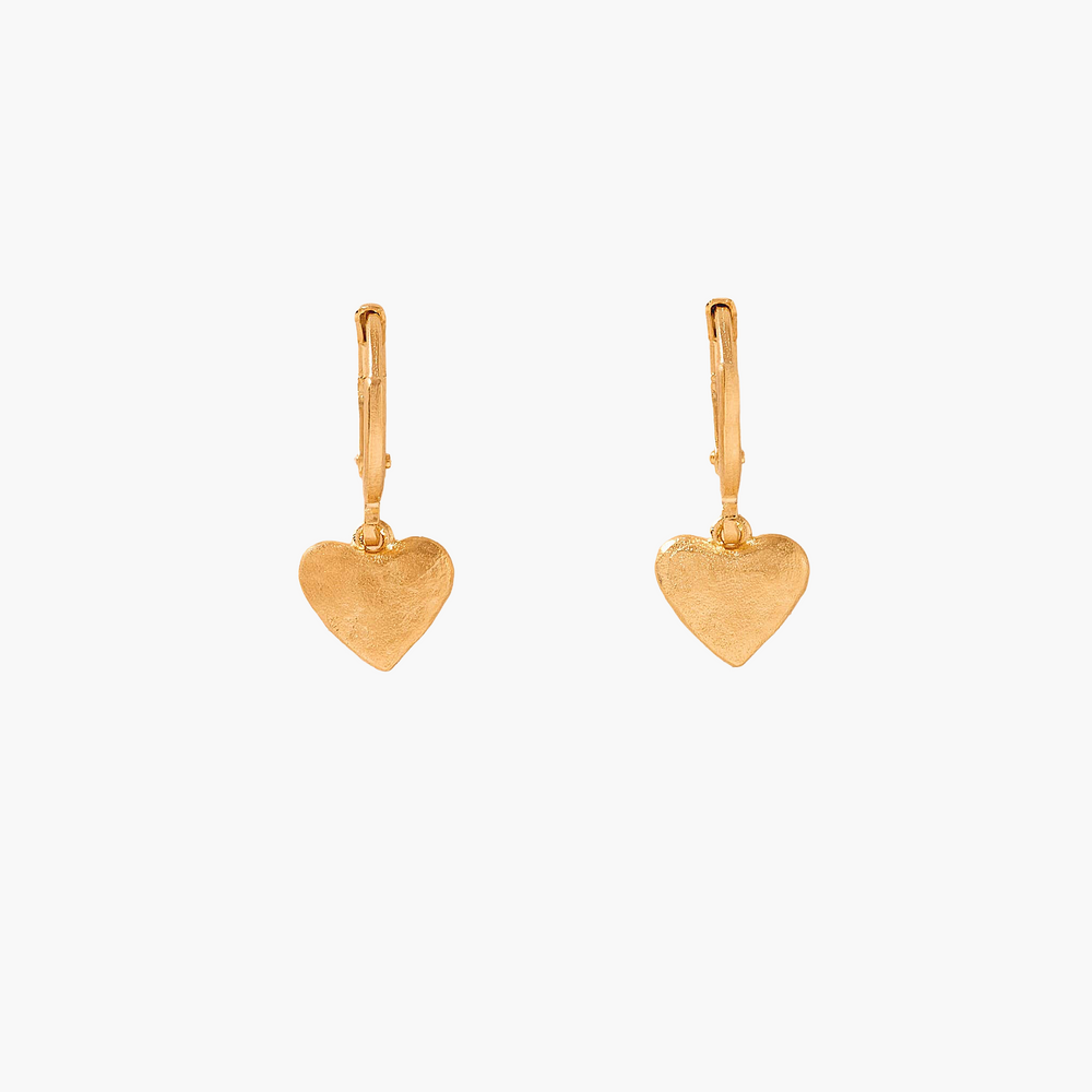 Gold heart-shaped earrings on a white background