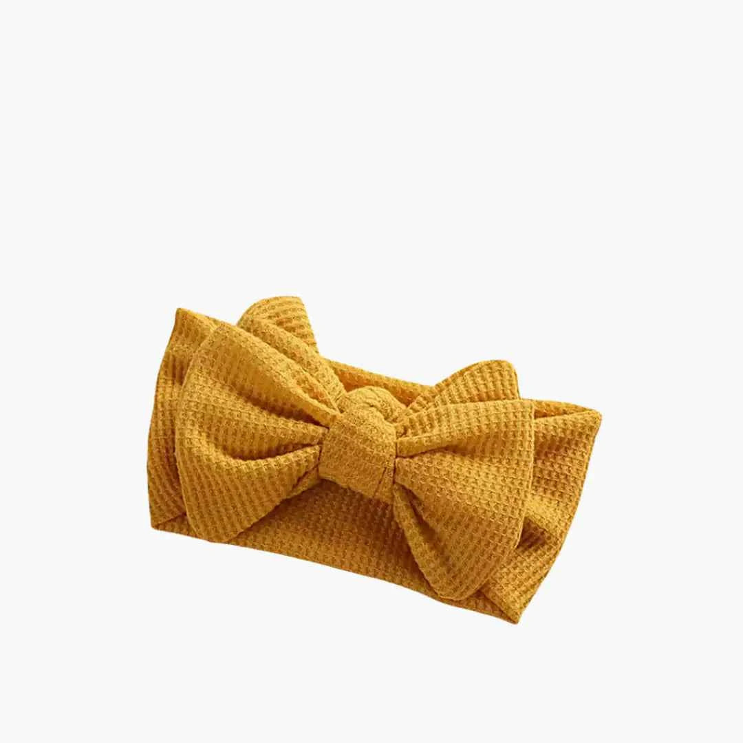 Babybow yellowheadband with a soft bow design for girls and babies, perfect for comfortable everyday styling
