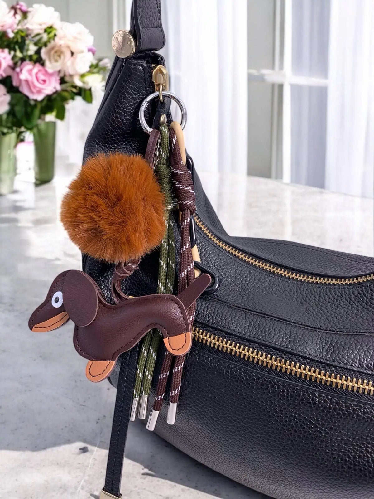 Cute plush puppy bag charm designed to add a playful and adorable touch to handbags and everyday bags