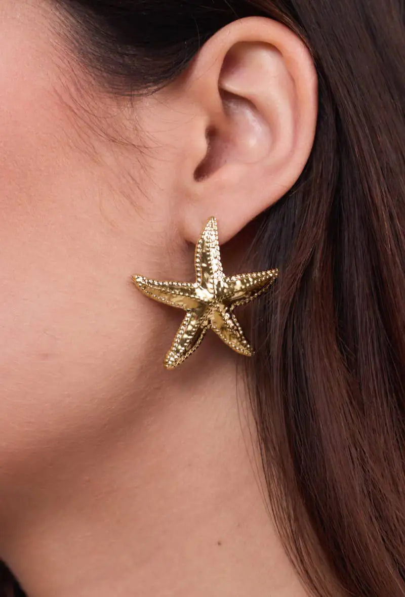 Elegant gold-tone starfish earrings featuring a refined coastal-inspired design for women