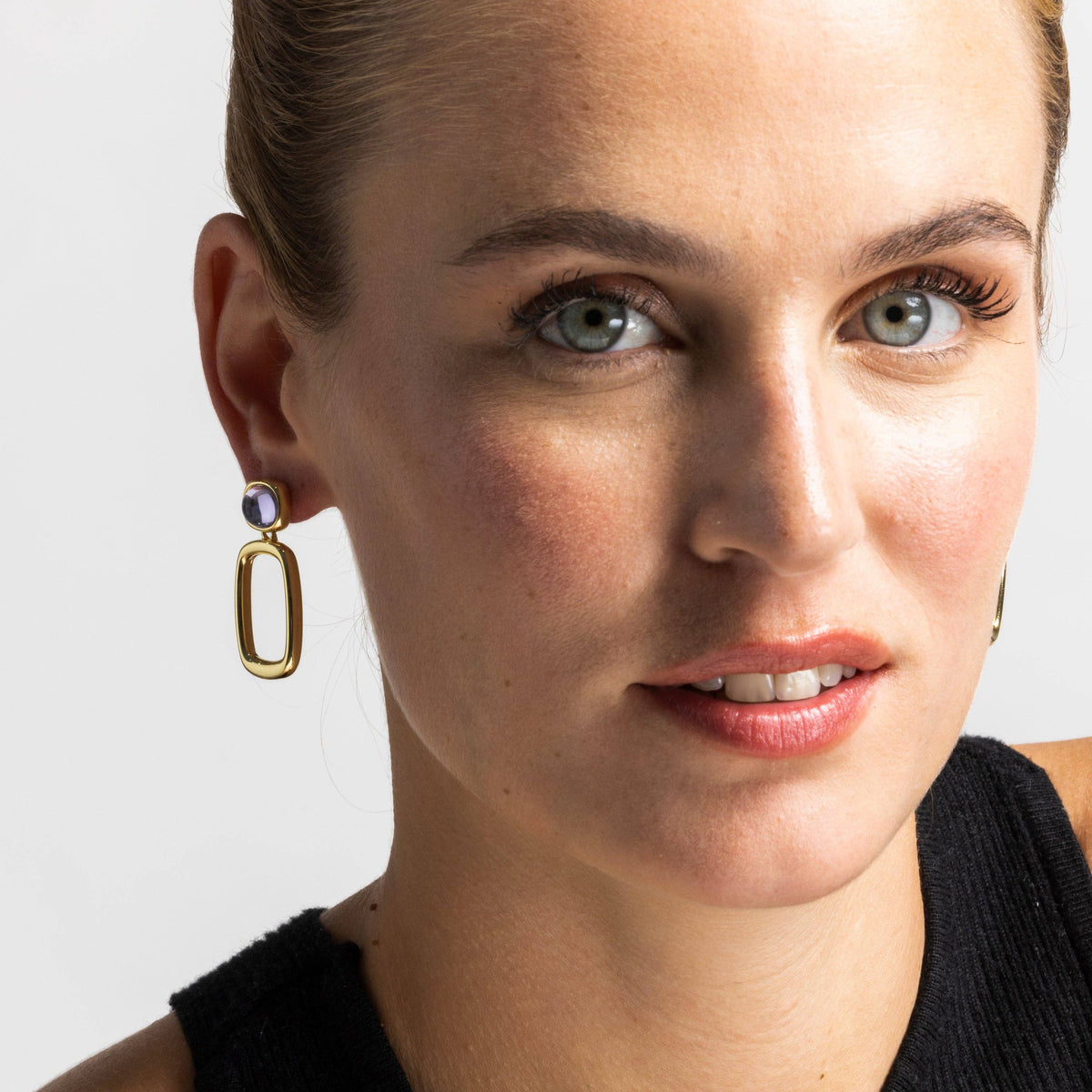 Elegant Orzur purple crystal earrings featuring a refined 18K gold finish for sophisticated jewellery styling
