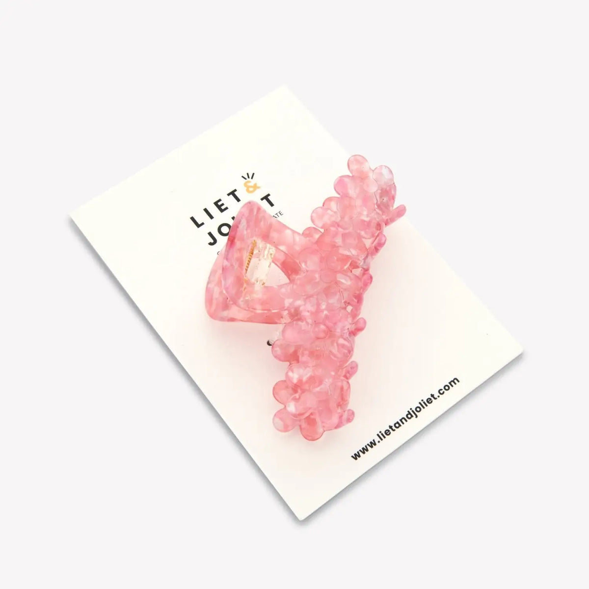 Elegant pink floral hair clip for women featuring a romantic flower design for everyday hairstyles