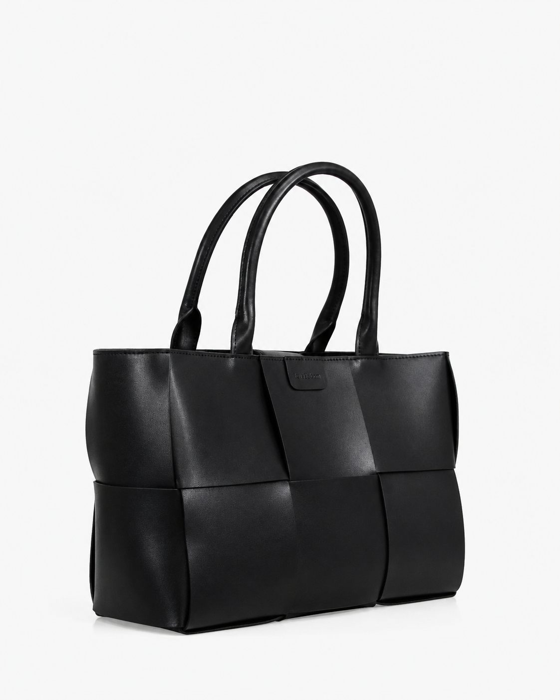 Elegant woven leather tote bag featuring a sophisticated textured design for everyday and occasion styling