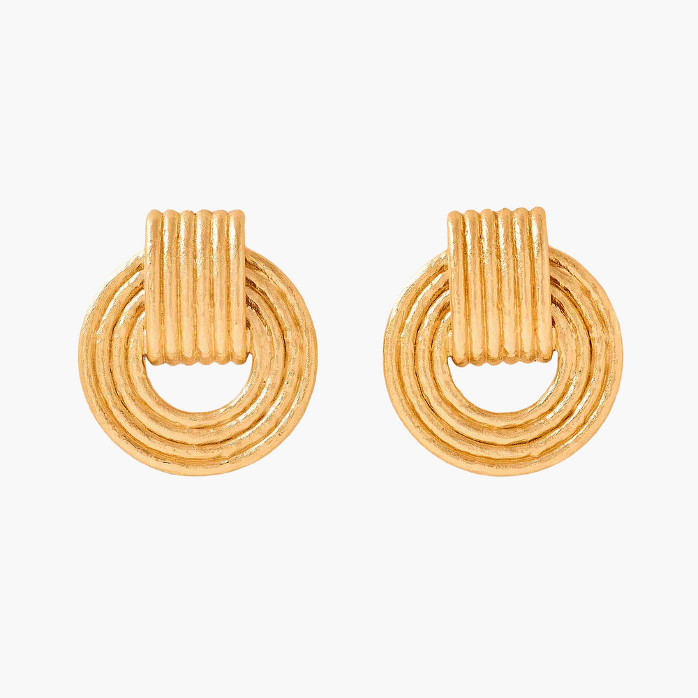 Pair of gold hoop earrings on a white background