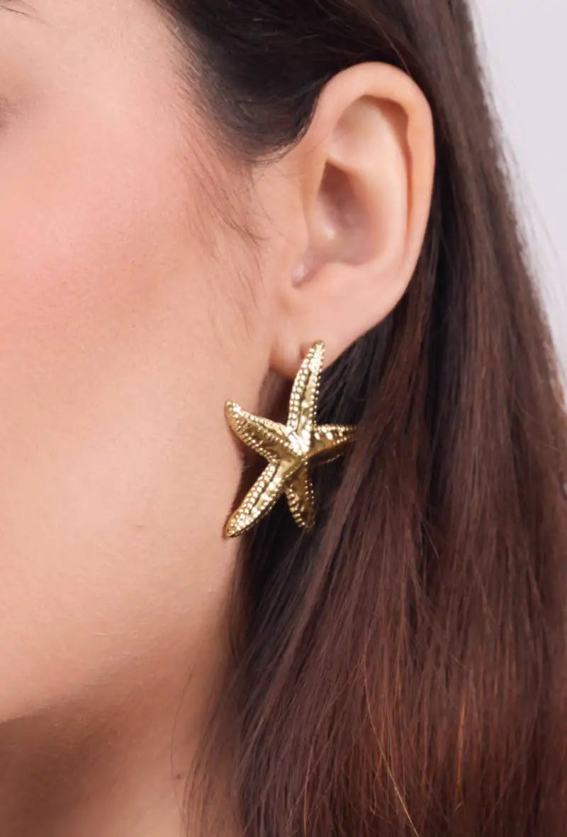 Gold starfish statement earrings with a sophisticated coastal-inspired design and elegant gold-tone finish
