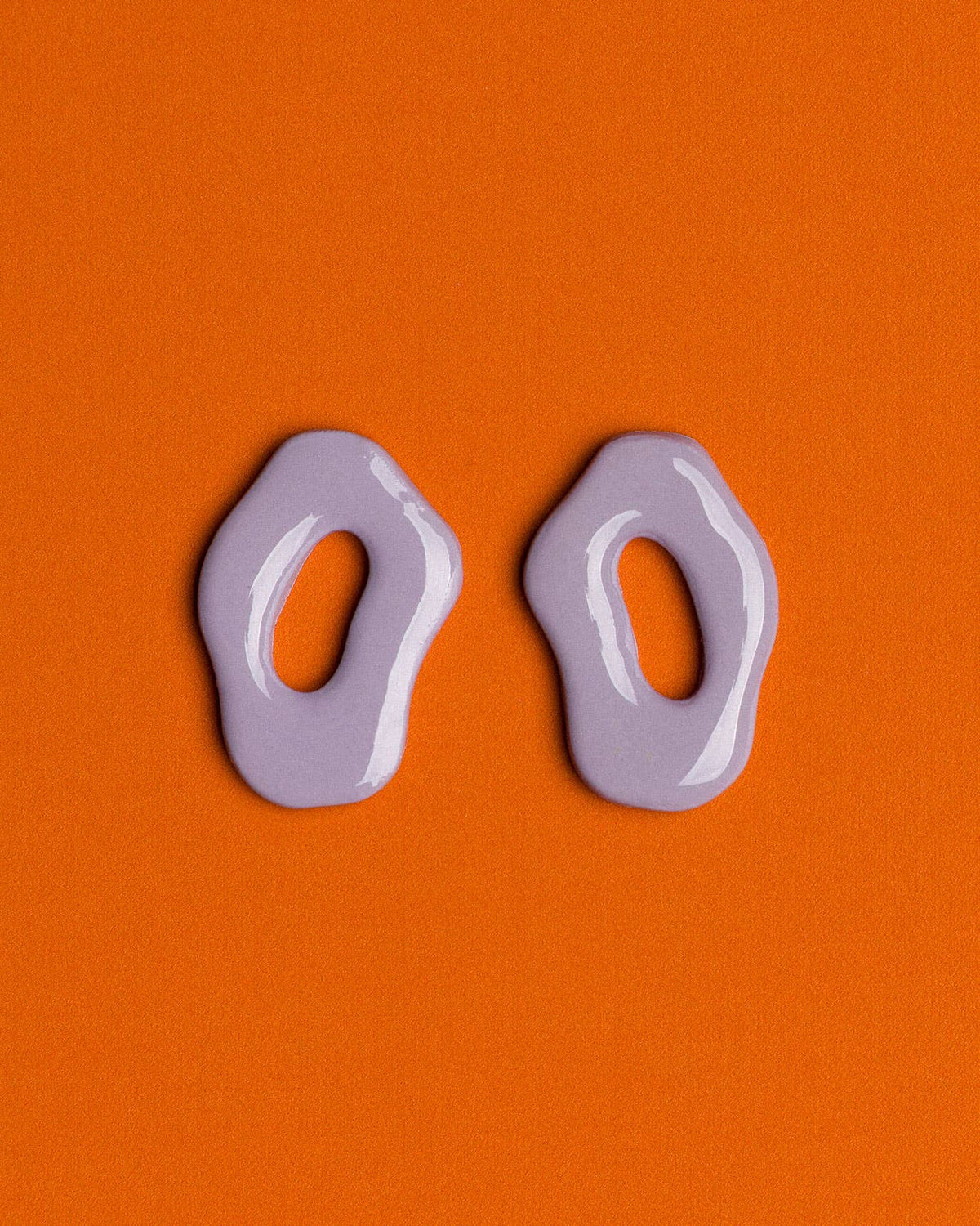 Handmade lavender polymer clay earrings featuring a lightweight design and sophisticated oval shape