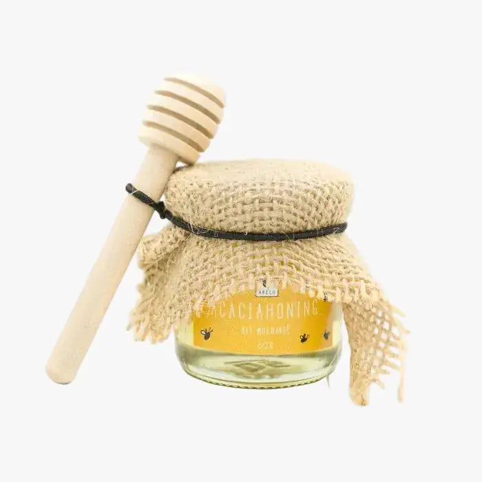 Honey pot with spoon featuring an elegant design for stylish honey storage and serving