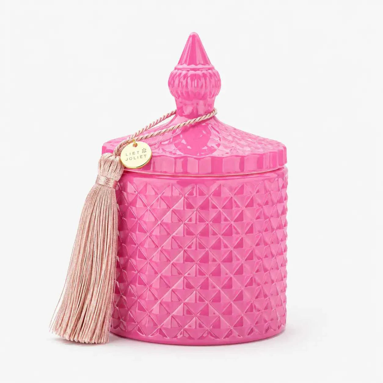 Luxurious pink scented candle in elegant glass jar