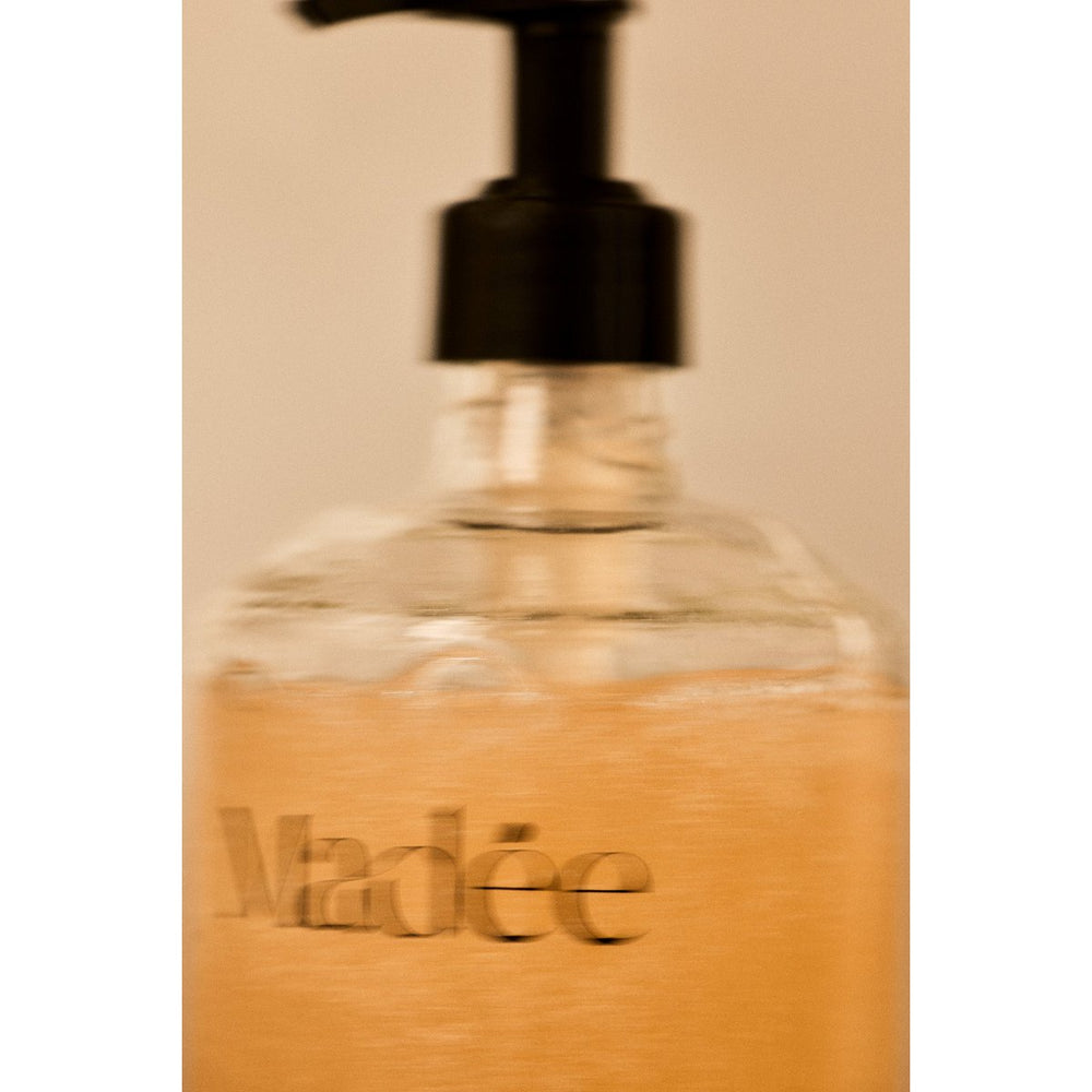 Skincare product packaging with 'Madée' branding on a white background