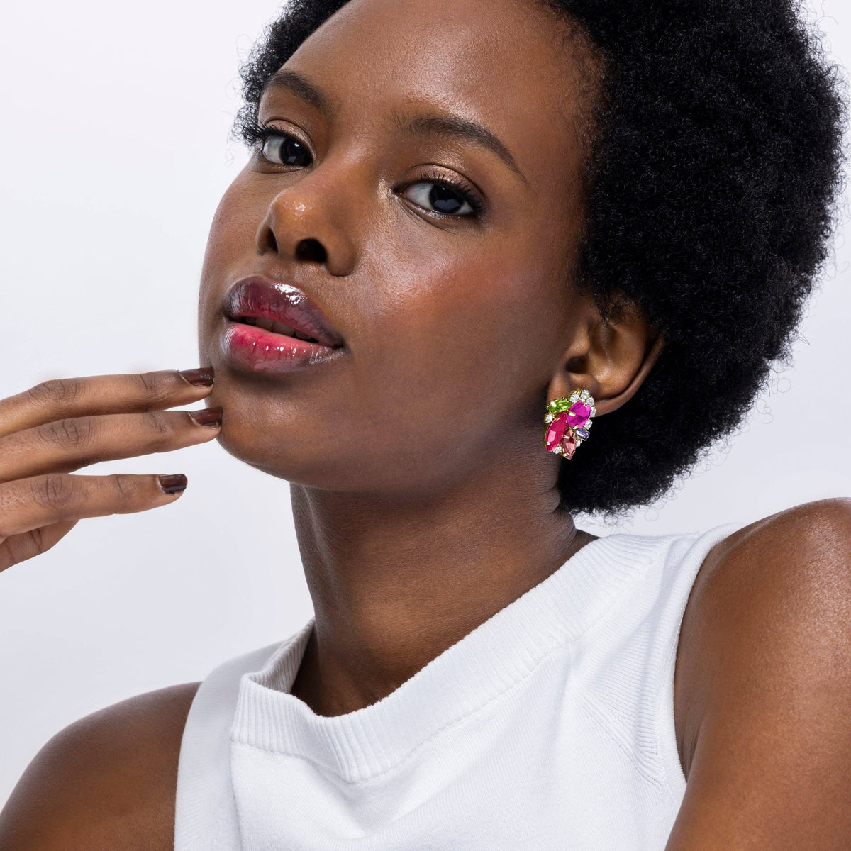 Mutaj colorful botanical statement earrings combining red and pink floral details in an eye-catching design