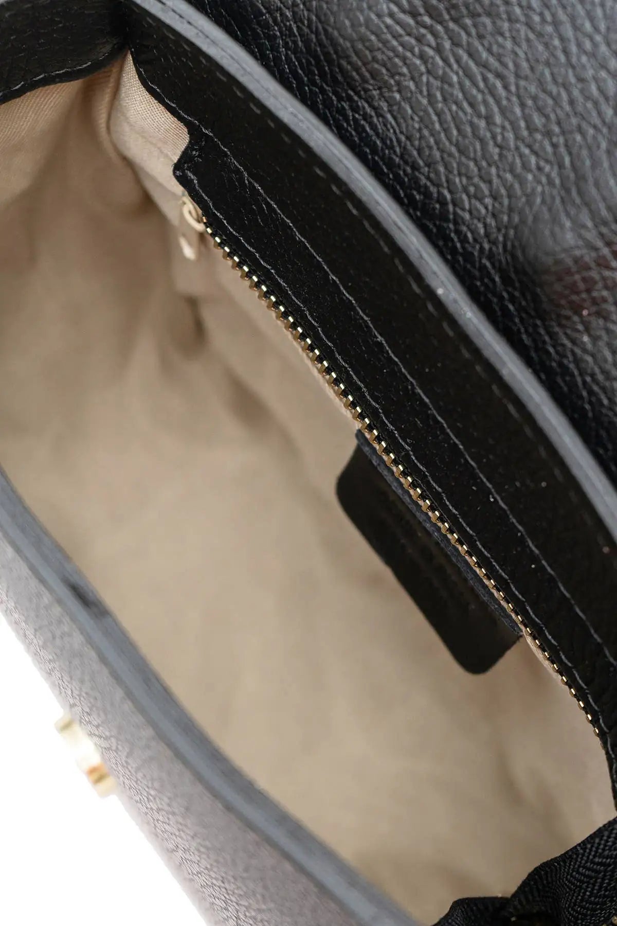 Premium leather crossbody shoulder bag with a distinctive grained texture and elegant design for women