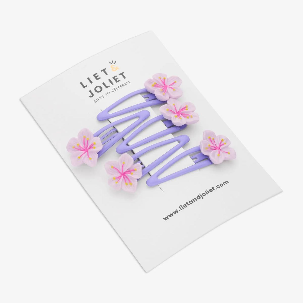 Purple flower hair clip with an elegant floral design for women and girls, perfect for romantic everyday styling
