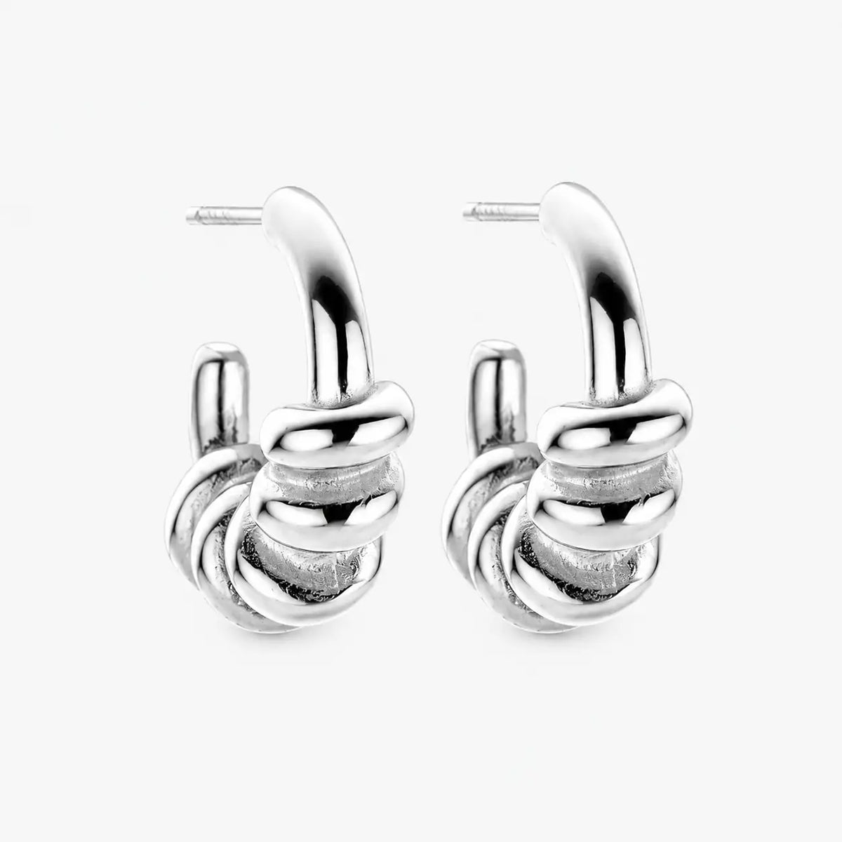 Silver Vada earrings with an elegant silver-tone finish and refined modern statement design