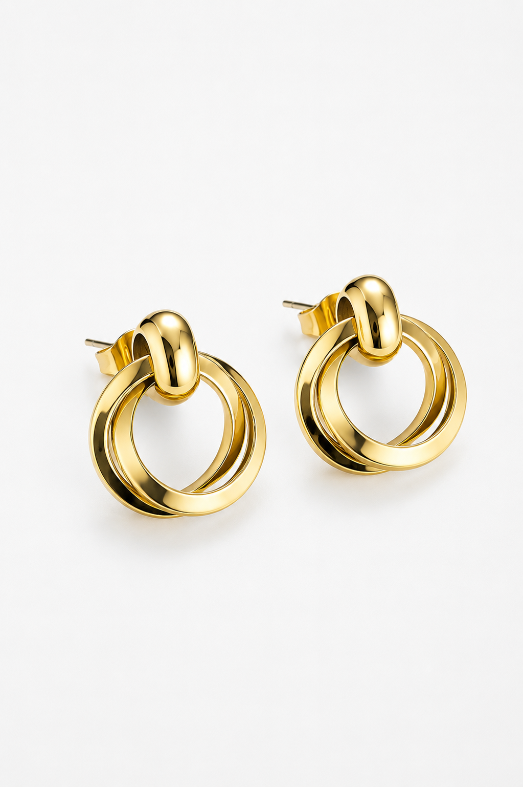 Pair of gold hoop earrings on a white background