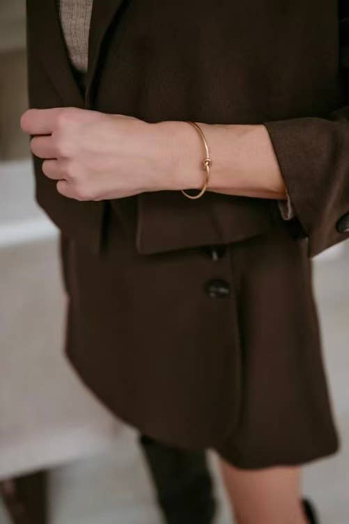 Water-resistant gold stainless steel knot ring designed for elegant everyday jewellery wear