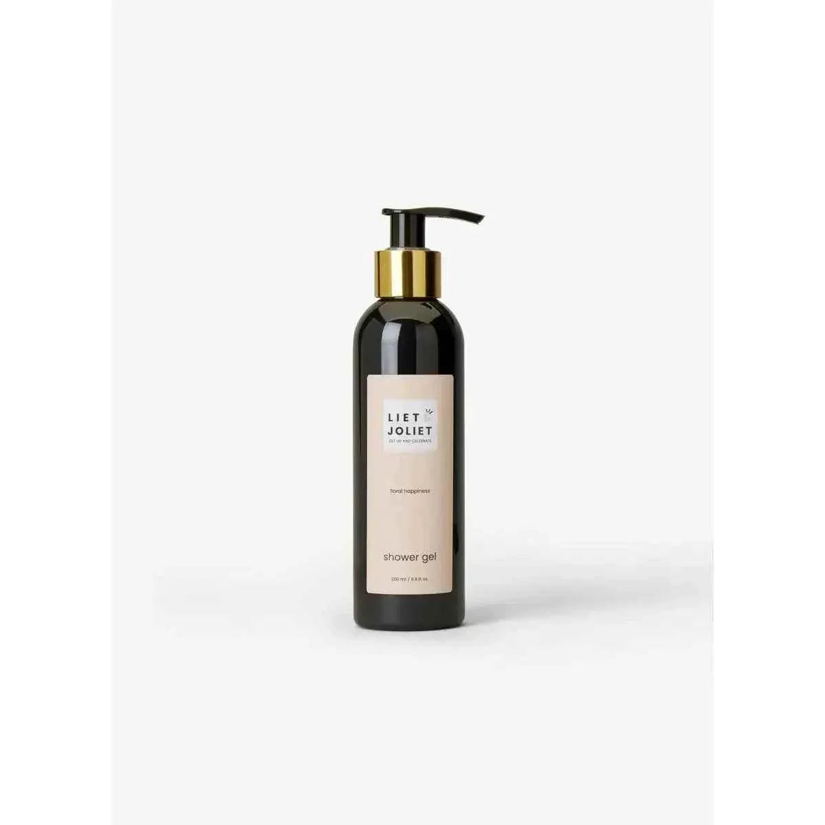 Liet & Joliet Floral Happiness Showergel in a sleek black pump bottle with a gold collar and beige label