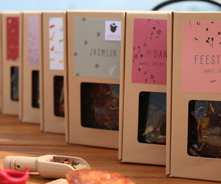 ARELO TEA loose-leaf tea with elegant packaging and tea accessories supporting inclusive business practices