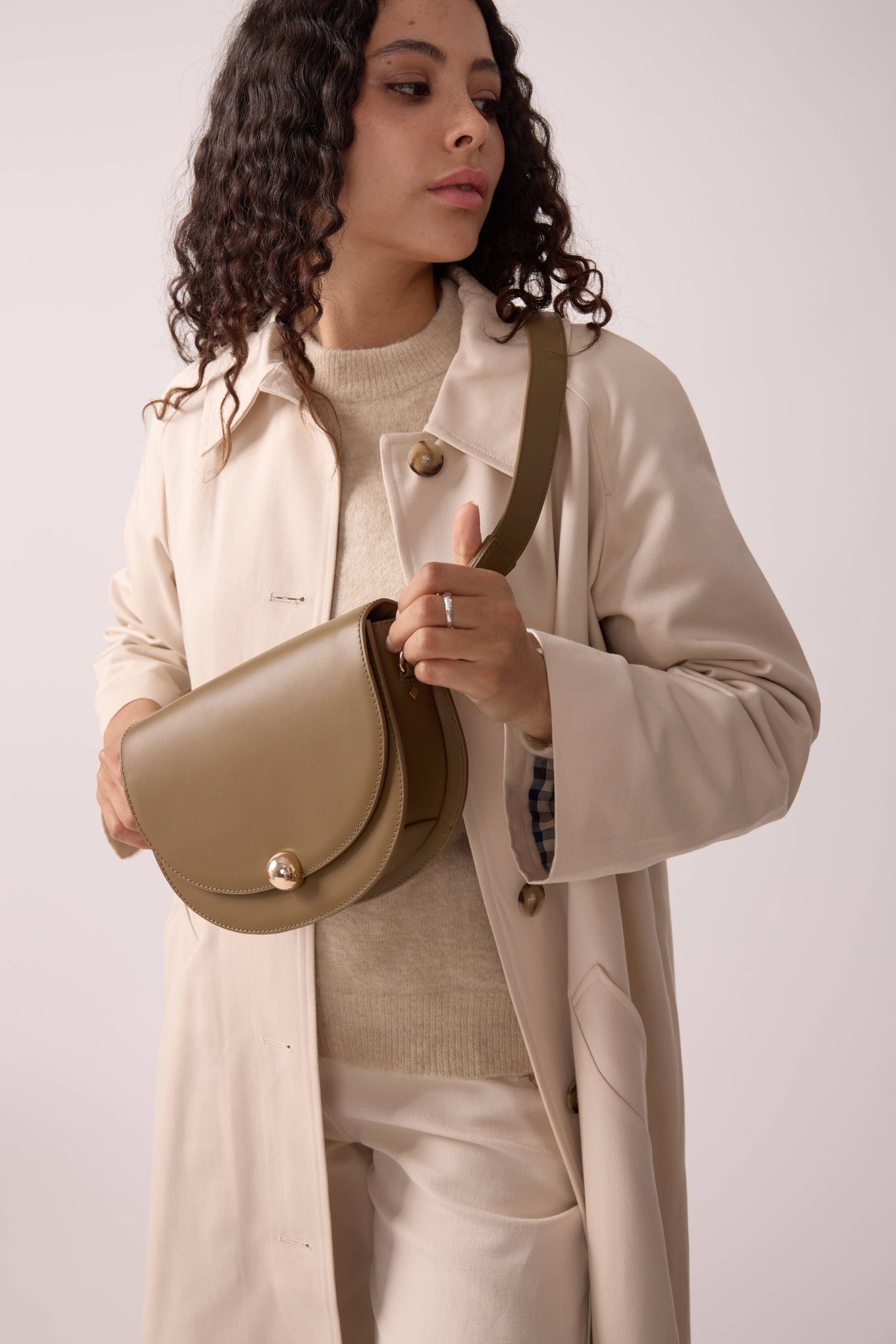 Maradji Noa bronze leather baguette bag with elegant crescent-shaped shoulder design