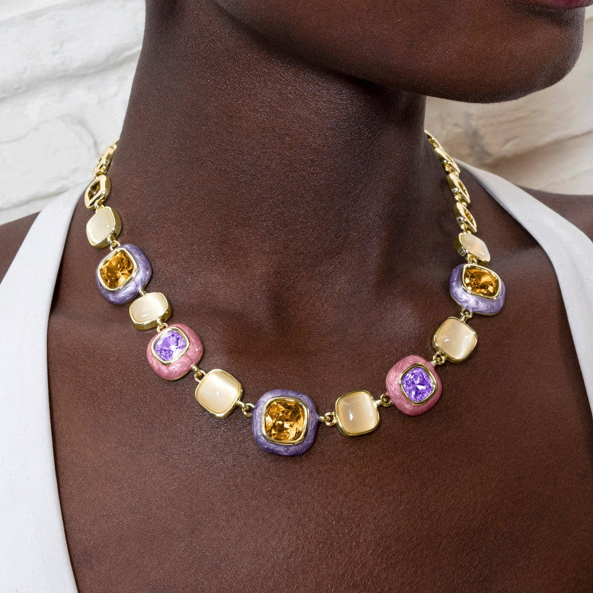 
Elegant multicolor beaded statement necklace with a gold-tone chain, designed to add colour and sophistication to any outfit