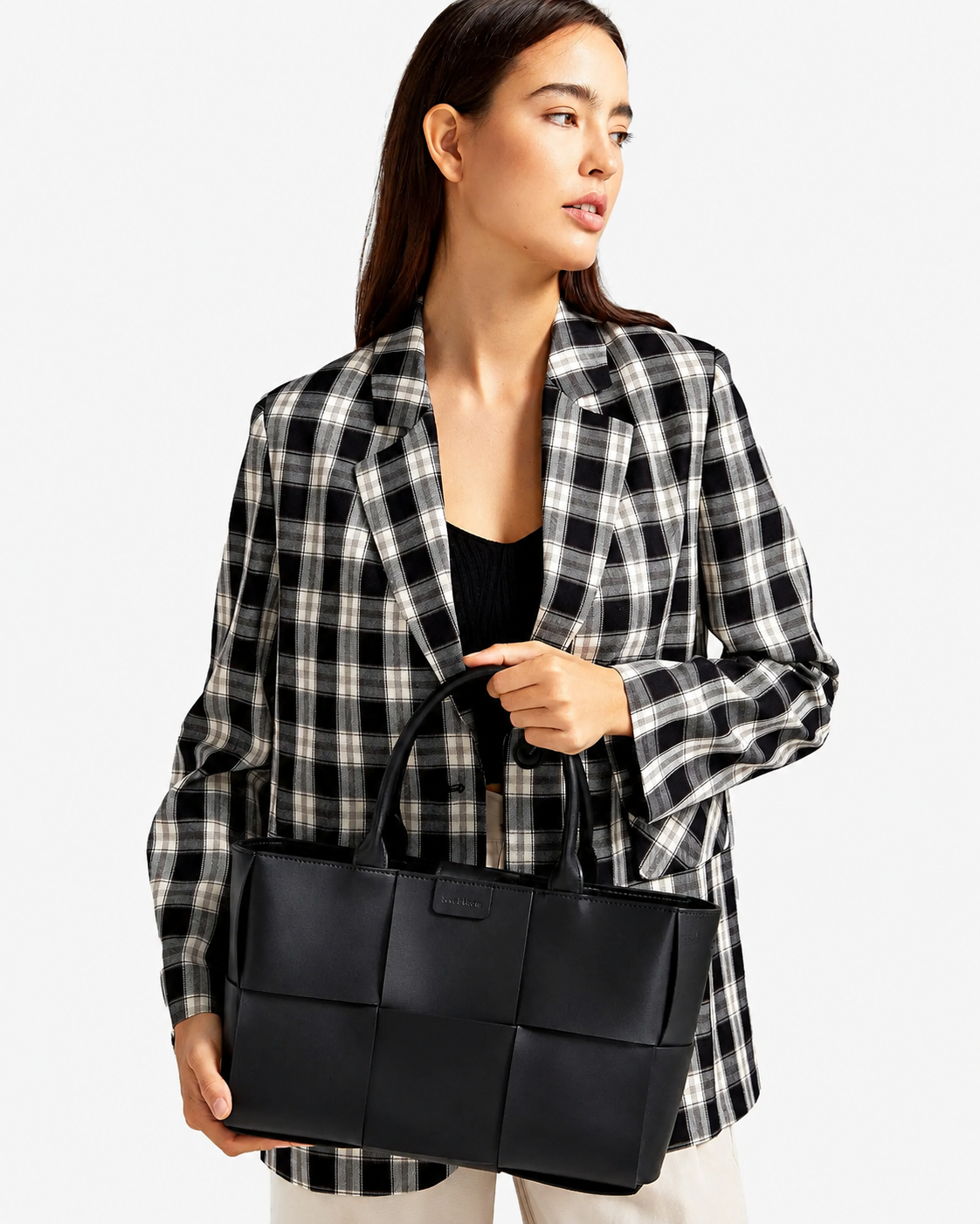 Elegant woven leather handbag featuring a refined tote design for versatile everyday styling