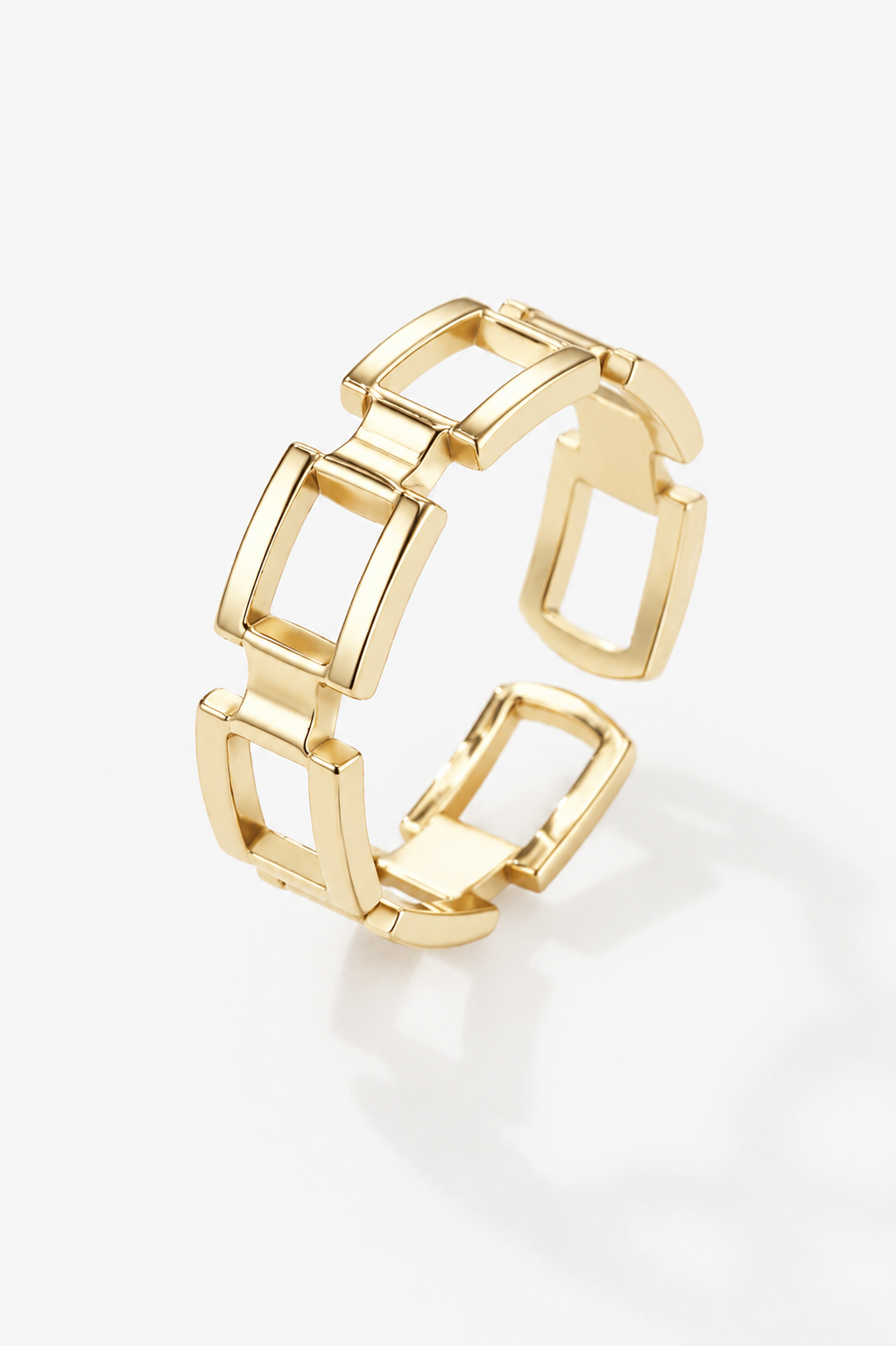 Gold chain-link ring on a white background