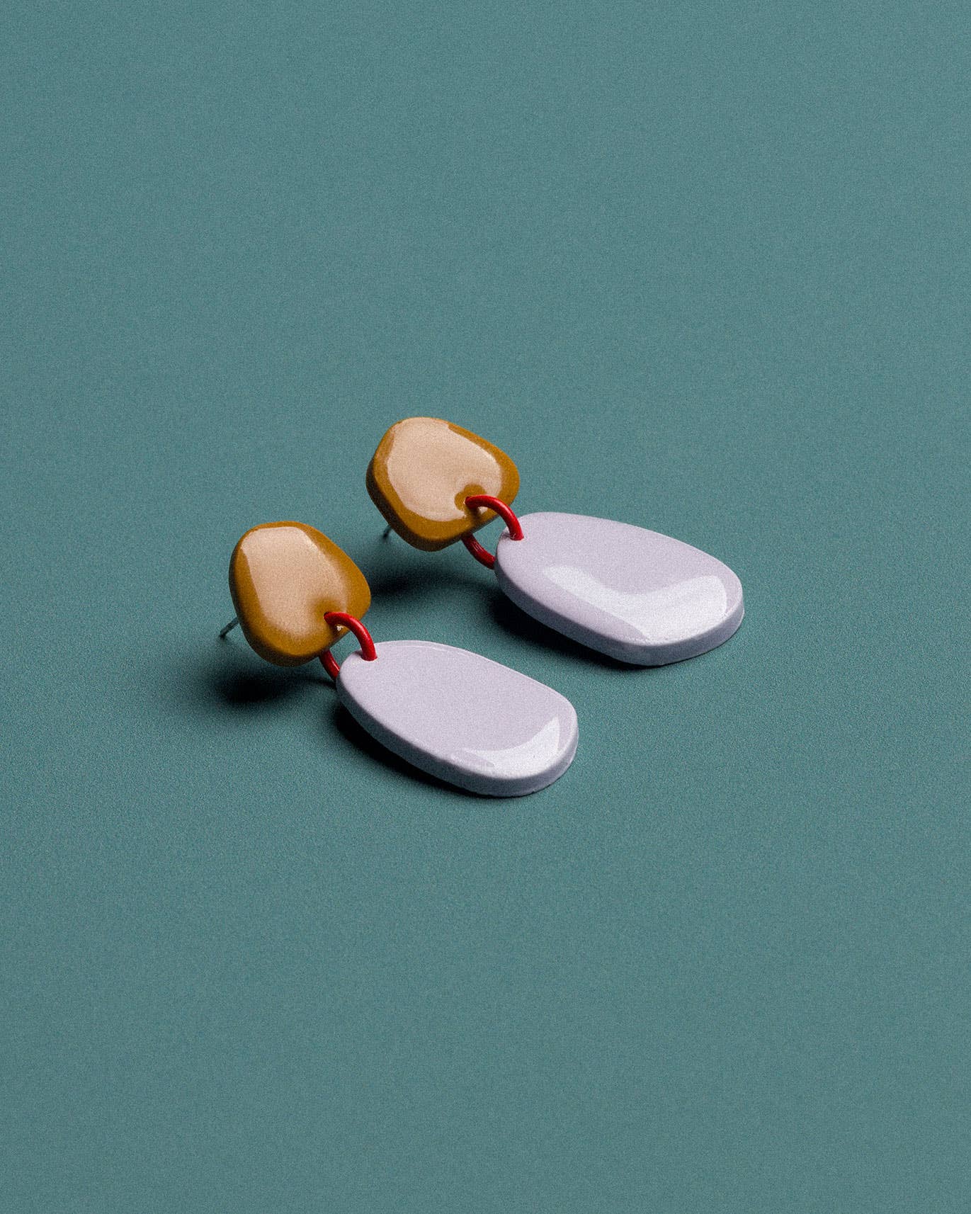 Handmade mustard and blue polymer clay earrings with a lightweight design and distinctive contemporary style