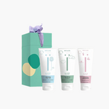 Naïf Mini Shower Routine set with cleansing washgel, nourishing shampoo, and softening body lotion.