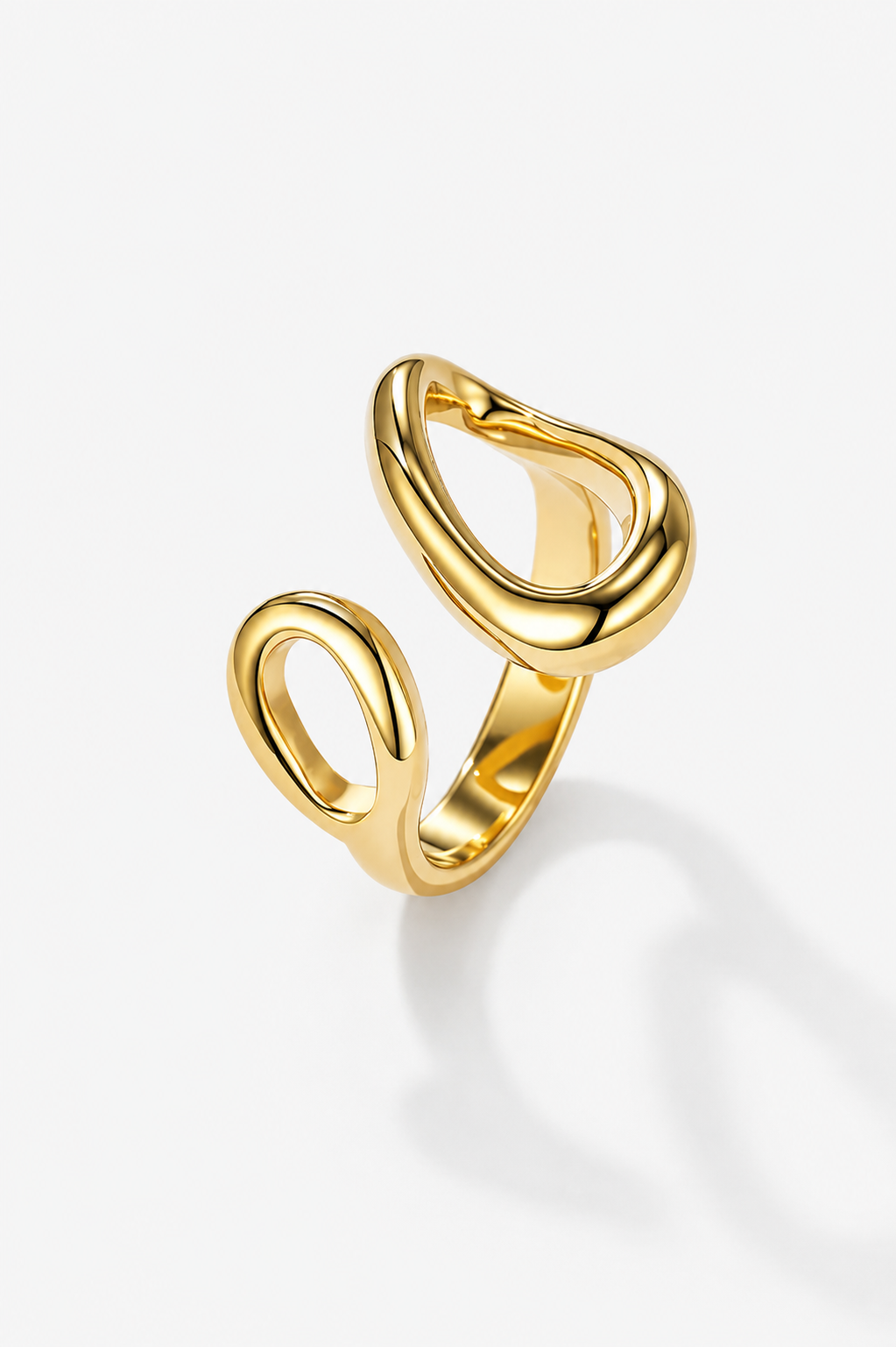 Gold open ring on a light gray background