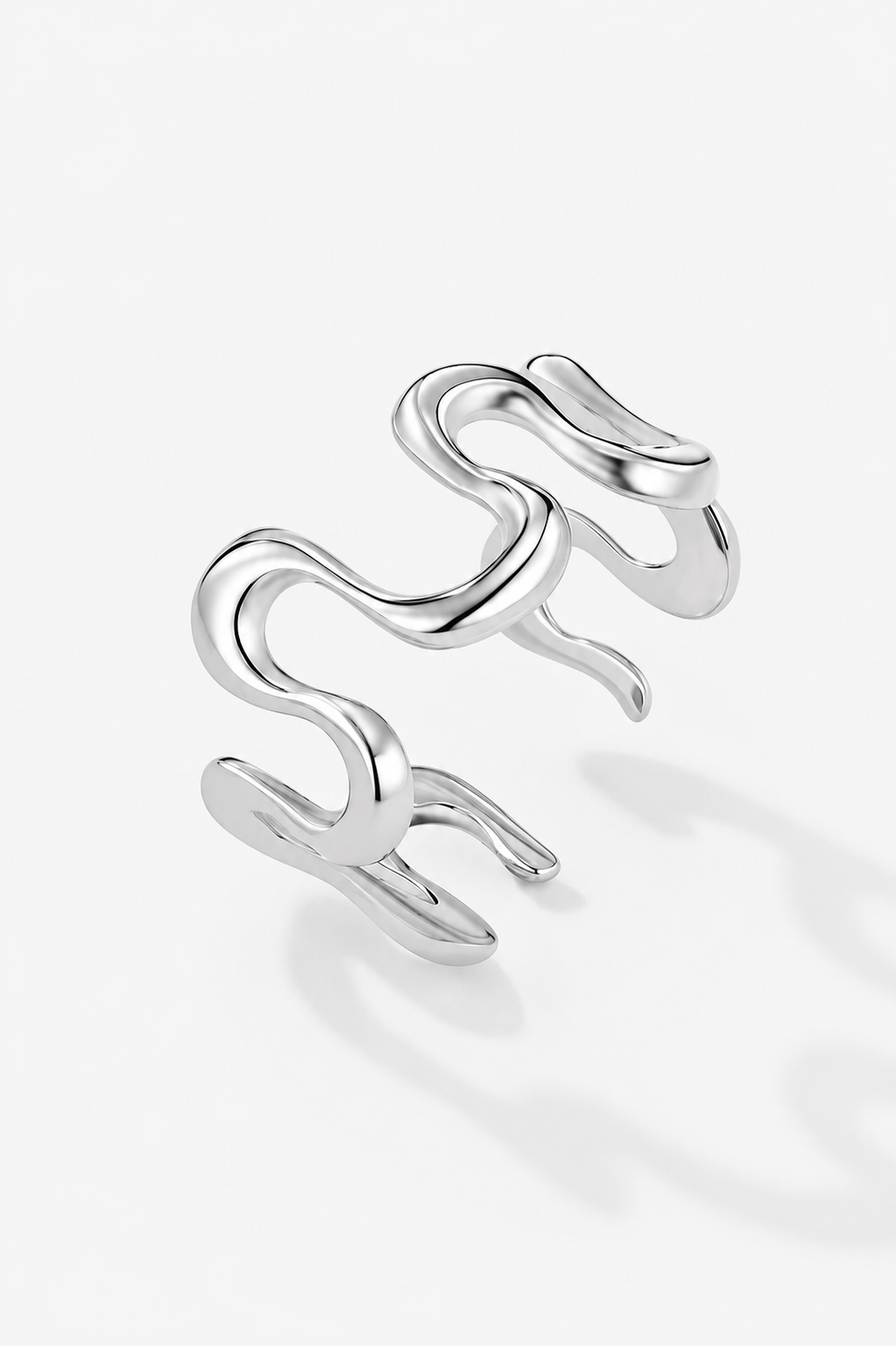 Silver-shaped ring on a white background