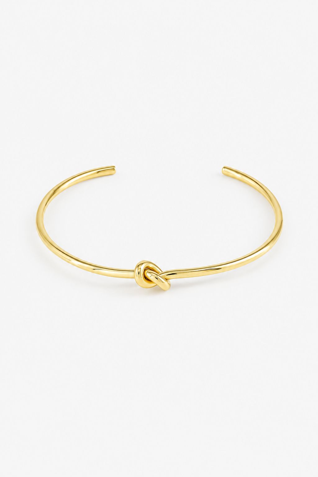 Stainless steel knot ring with a water-resistant gold-tone finish and elegant minimalist design
