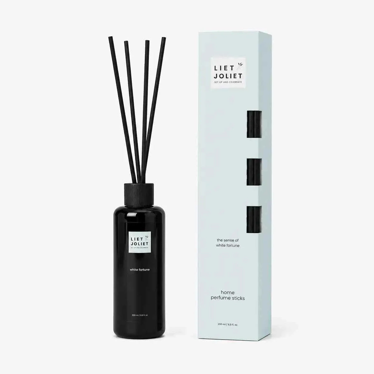 Liet & Joliet Fragrance Sticks White Fortune in sleek black glass bottle with black reed sticks and elegant light blue packaging
