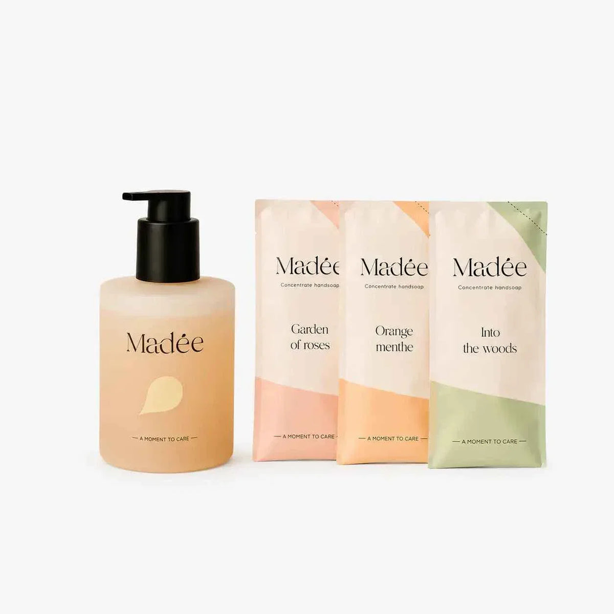 Madée Hand Soap Set featuring one peach-colored pump bottle and three pastel-colored refill sachets with floral and natural scent labels