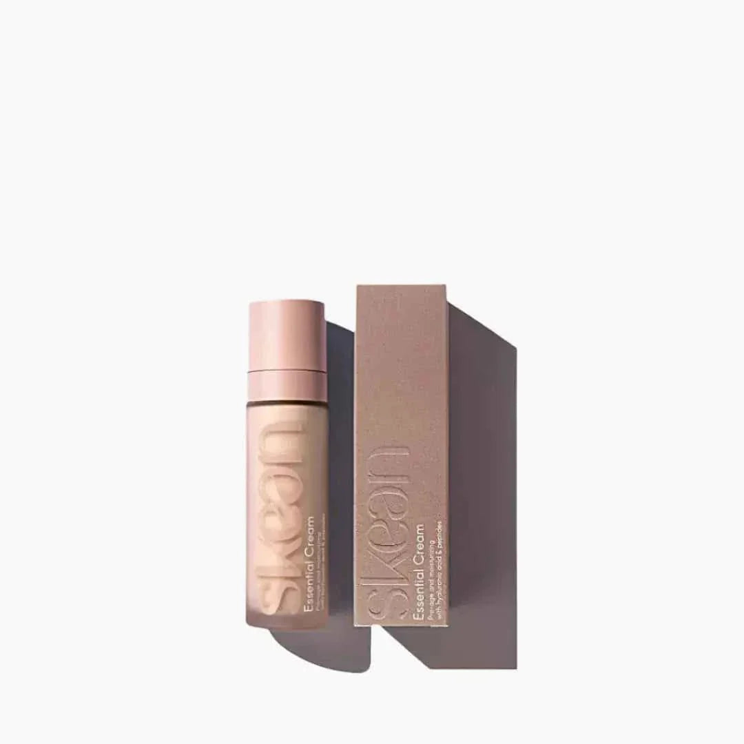 SkeanBeauty Essential Cream in a matte mauve pump bottle with matching rectangular box, minimalist design