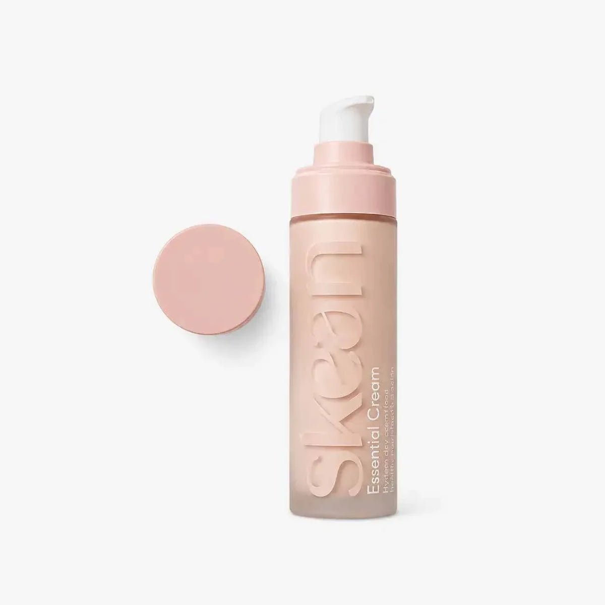 SkeanBeauty Essential Cream in a frosted pale pink plastic pump bottle with a matching pink cap, featuring sleek embossed branding