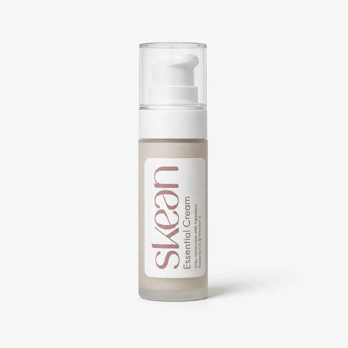 SkeanBeauty Essential Cream Travel Size in a small clear frosted bottle with white pump and label, featuring soft pink and grey text